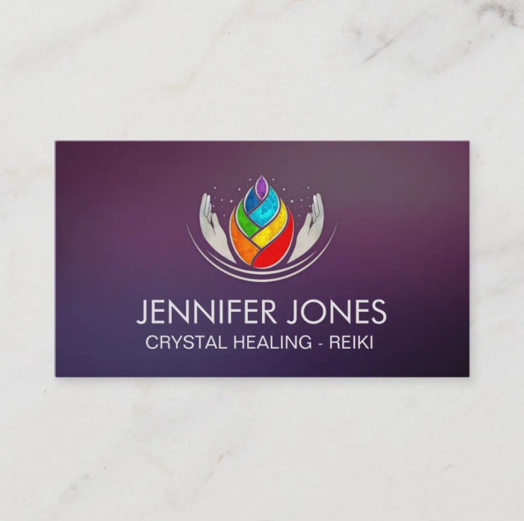Hands with chakras and lotus petals – spiritual business card for yoga and holistic practitioners.