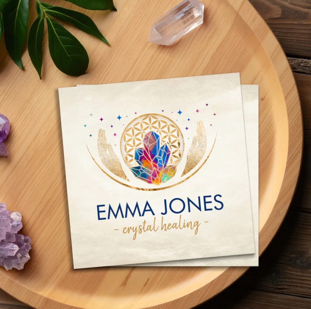 Healing hands with chakra-colored crystals and Flower of Life – business card for wellness and Reiki.