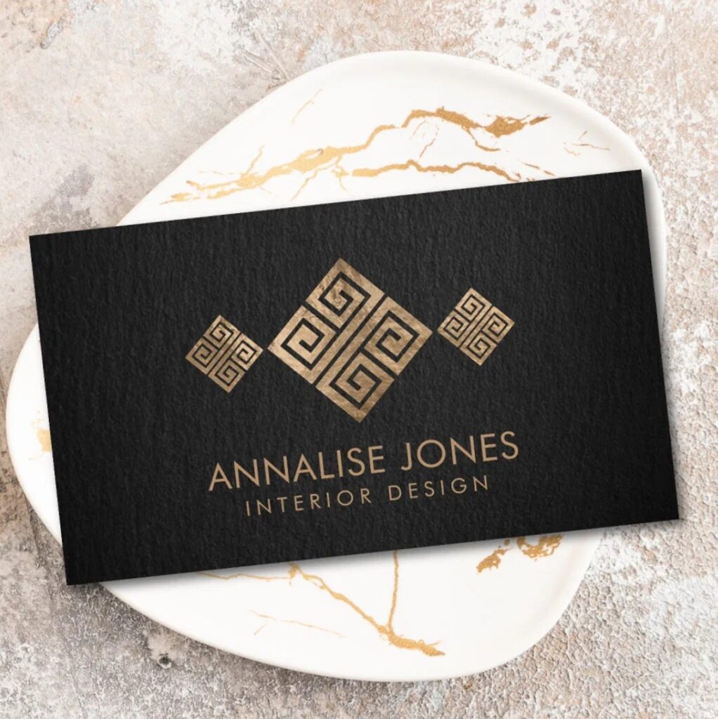 Elegant Greek Key business card with gold on black design