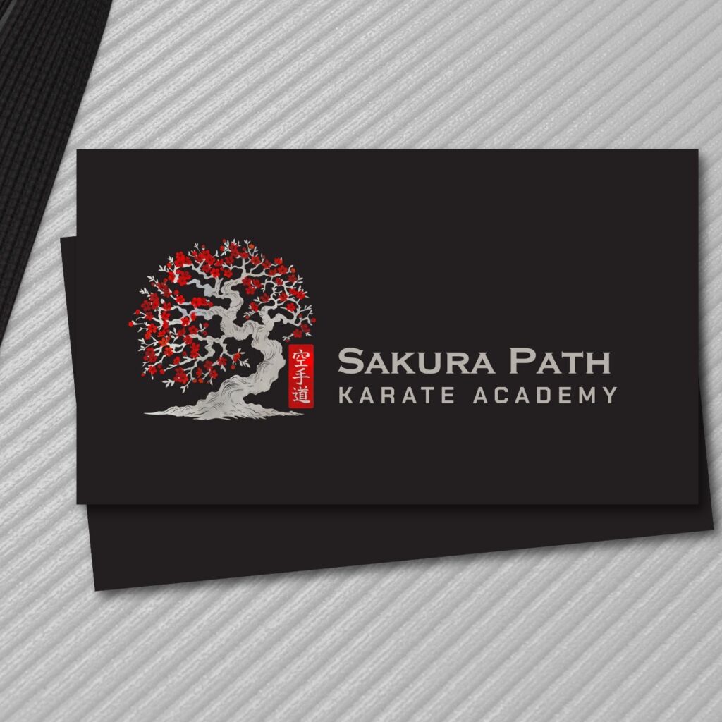 Karate dojo business card with red sakura blossom design